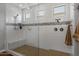 Large walk-in shower with a built-in seat at 10556 E Relativity Ave, Mesa, AZ 85212