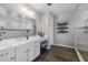 Elegant bathroom with a double vanity and walk-in shower at 10556 E Relativity Ave, Mesa, AZ 85212