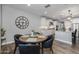 Kitchen dining area with round wooden table and four chairs at 10556 E Relativity Ave, Mesa, AZ 85212