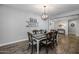 Farmhouse style dining room with a rustic wooden table at 10556 E Relativity Ave, Mesa, AZ 85212