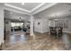 Open concept dining room with rustic table and chandelier at 10556 E Relativity Ave, Mesa, AZ 85212