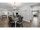 Farmhouse style dining room with a rustic wooden table at 10556 E Relativity Ave, Mesa, AZ 85212