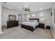 Spacious main bedroom with carpeted floors and ensuite bathroom at 10556 E Relativity Ave, Mesa, AZ 85212