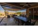 Outdoor dining area with pergola and seating at 10556 E Relativity Ave, Mesa, AZ 85212