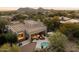 Aerial view showcasing house, pool, and desert landscape at 11060 E Mark Ln, Scottsdale, AZ 85262