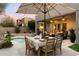 Backyard with dining area, spa and lounge chairs at 11060 E Mark Ln, Scottsdale, AZ 85262