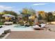 Inviting backyard with a pool, spa, and comfortable seating area at 11060 E Mark Ln, Scottsdale, AZ 85262