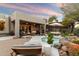 Peaceful backyard oasis with a spa and seating area at 11060 E Mark Ln, Scottsdale, AZ 85262