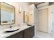 Modern bathroom with dual sinks and a large mirror at 11060 E Mark Ln, Scottsdale, AZ 85262