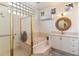 Bathroom with a large walk-in shower and a soaking tub at 11060 E Mark Ln, Scottsdale, AZ 85262