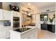 Modern kitchen with stainless steel appliances and white cabinetry at 11060 E Mark Ln, Scottsdale, AZ 85262