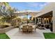 Outdoor dining area on patio with seating for six at 11060 E Mark Ln, Scottsdale, AZ 85262