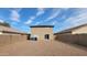 Tan two story house with gravel backyard at 11215 W Heatherbrae Dr, Phoenix, AZ 85037