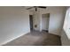 Well-lit bedroom featuring a mirrored closet and carpet at 11215 W Heatherbrae Dr, Phoenix, AZ 85037