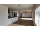 Combined dining and living area with laminate floors at 11215 W Heatherbrae Dr, Phoenix, AZ 85037