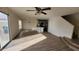 Living room with laminate floors and kitchen view at 11215 W Heatherbrae Dr, Phoenix, AZ 85037