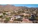 Aerial view of house and surrounding neighborhood, mountain backdrop at 12824 E Jenan Dr, Scottsdale, AZ 85259