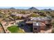 Aerial view showcasing house, pool, and mountain views at 12824 E Jenan Dr, Scottsdale, AZ 85259