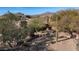 Aerial view showcases the home's design and desert landscape at 12824 E Jenan Dr, Scottsdale, AZ 85259