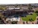 Luxury home with a large pool, grassy backyard, and expansive patio at 12824 E Jenan Dr, Scottsdale, AZ 85259