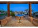 Stunning mountain views from this covered patio overlooking a sparkling pool and expansive backyard at 12824 E Jenan Dr, Scottsdale, AZ 85259