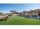 Artificial turf backyard, pool, and patio area at 12824 E Jenan Dr, Scottsdale, AZ 85259