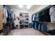 Large walk-in closet with ample shelving and hanging space at 12824 E Jenan Dr, Scottsdale, AZ 85259