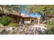 Peaceful courtyard with fountain and desert landscaping at 12824 E Jenan Dr, Scottsdale, AZ 85259