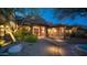 Elegant home exterior with walkway, landscaping, and lighting at dusk at 12824 E Jenan Dr, Scottsdale, AZ 85259