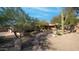 Front yard with desert landscaping and walkway to entrance at 12824 E Jenan Dr, Scottsdale, AZ 85259