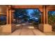 View through entryway to a tranquil front yard with fountain at 12824 E Jenan Dr, Scottsdale, AZ 85259