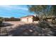 Two-car garage with large driveway and desert landscaping at 12824 E Jenan Dr, Scottsdale, AZ 85259