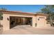 Two-car garage with open doors revealing interior space at 12824 E Jenan Dr, Scottsdale, AZ 85259