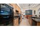 Bright kitchen with ample counter space, stainless steel appliances, and wood cabinets at 12824 E Jenan Dr, Scottsdale, AZ 85259