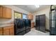 Laundry room with washer, dryer, and ample counter space at 12824 E Jenan Dr, Scottsdale, AZ 85259