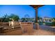 Outdoor kitchen with built-in grill, perfect for entertaining at 12824 E Jenan Dr, Scottsdale, AZ 85259