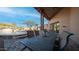 Spacious covered patio with dining area, adjacent to pool and landscape at 12824 E Jenan Dr, Scottsdale, AZ 85259