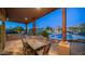 Expansive covered patio with outdoor dining and pool views at 12824 E Jenan Dr, Scottsdale, AZ 85259