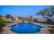 Resort-style pool with a stone patio, water feature, and mountain views at 12824 E Jenan Dr, Scottsdale, AZ 85259