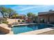 Inviting swimming pool with spacious patio and lounge chairs at 12824 E Jenan Dr, Scottsdale, AZ 85259