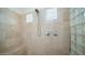 Large walk-in shower with built-in seat and glass block accents at 12824 E Jenan Dr, Scottsdale, AZ 85259