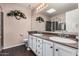 Double vanity bathroom with a shower and large mirror at 1313 W Glenmere Dr, Chandler, AZ 85224