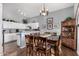 Dining area with wood table and chairs, adjacent to kitchen at 1313 W Glenmere Dr, Chandler, AZ 85224