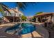 Inviting backyard pool with expansive patio and covered structure at 1313 W Glenmere Dr, Chandler, AZ 85224