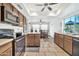 Bright kitchen with ample cabinetry, island, and dining area at 13232 N 54Th Dr, Glendale, AZ 85304