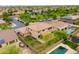 Aerial view of a house with a pool and backyard at 15296 W Coolidge St, Goodyear, AZ 85395