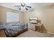 Cozy bedroom with a full-size bed and a flat-screen TV at 15296 W Coolidge St, Goodyear, AZ 85395