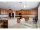 Kitchen with granite countertops, dark wood cabinets, and an island at 15296 W Coolidge St, Goodyear, AZ 85395