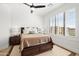 Bright bedroom with wood bed frame and plantation shutters at 16328 E Ridgeline Dr, Fountain Hills, AZ 85268