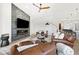 Spacious living room featuring a modern fireplace and leather furniture at 16328 E Ridgeline Dr, Fountain Hills, AZ 85268